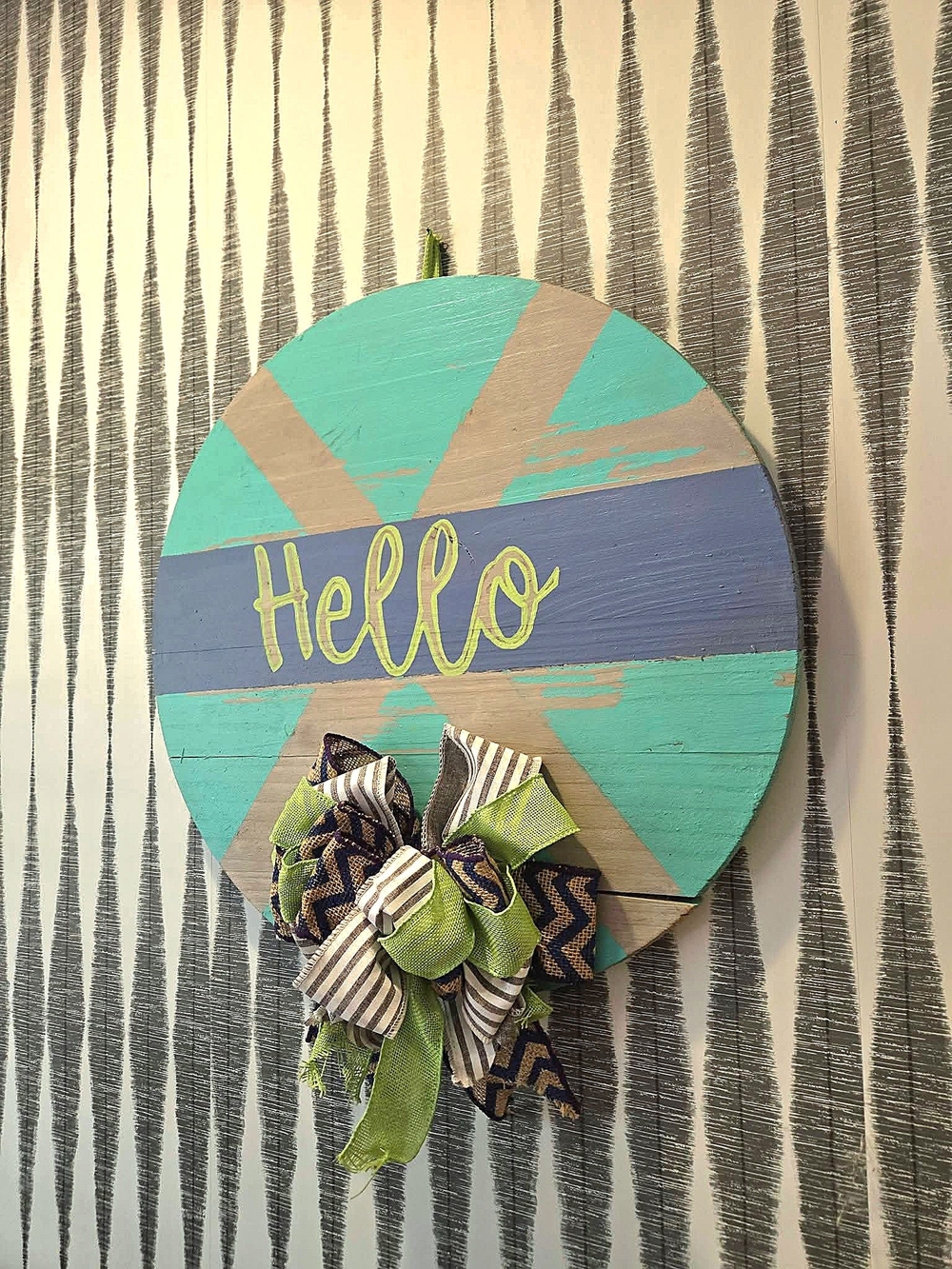 Round Hello Wall Sign with Navy Blue, Green, & Teal Accents